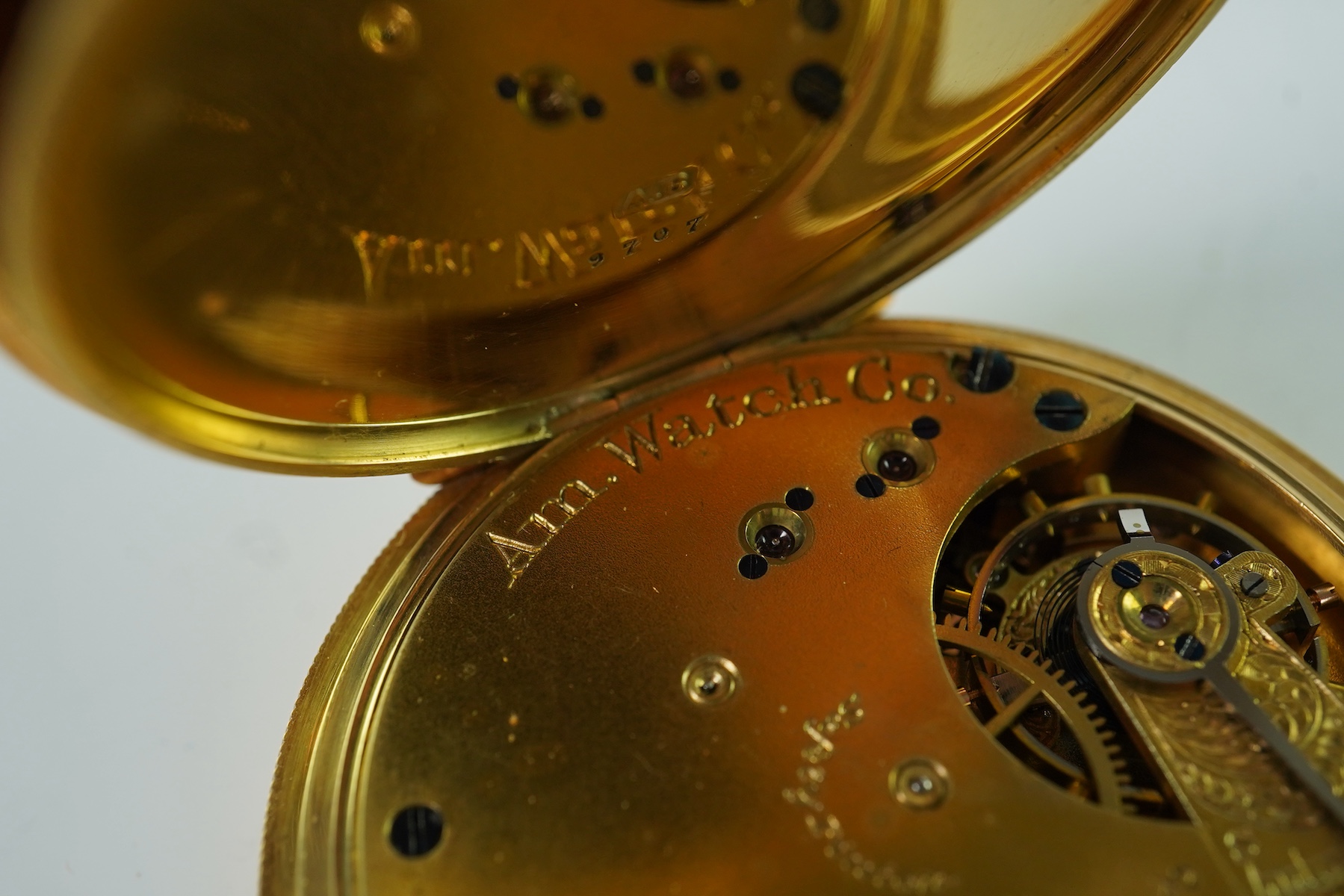 A late Victorian engine turned 18ct gold open faced keyless pocket watch by The American Waltham Watch Company